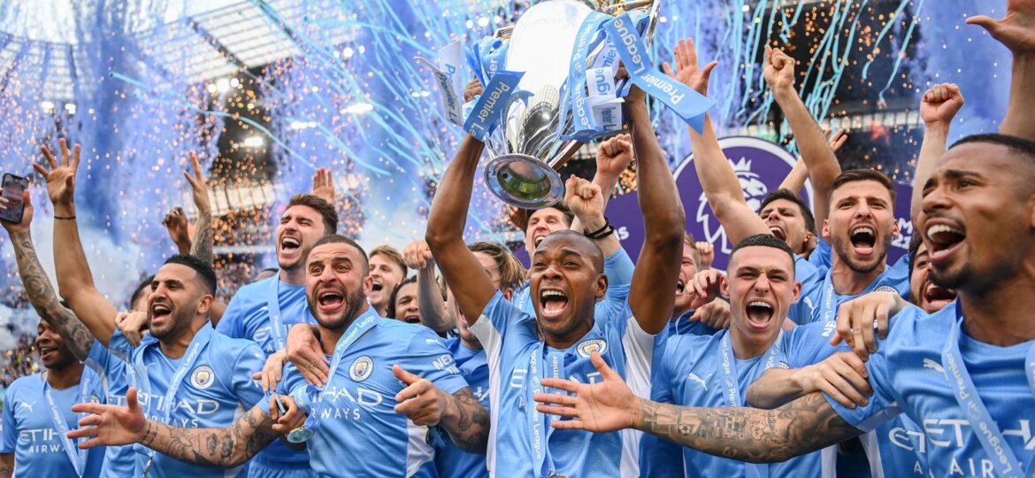 Manchester-City-Football-Club-team-celebrates-with-Premier-League-trophy-championship-May-22-2022